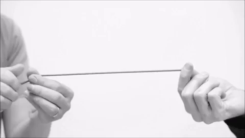 An elastic fiber is held under tension and twisted. A solenoid structure is produced.